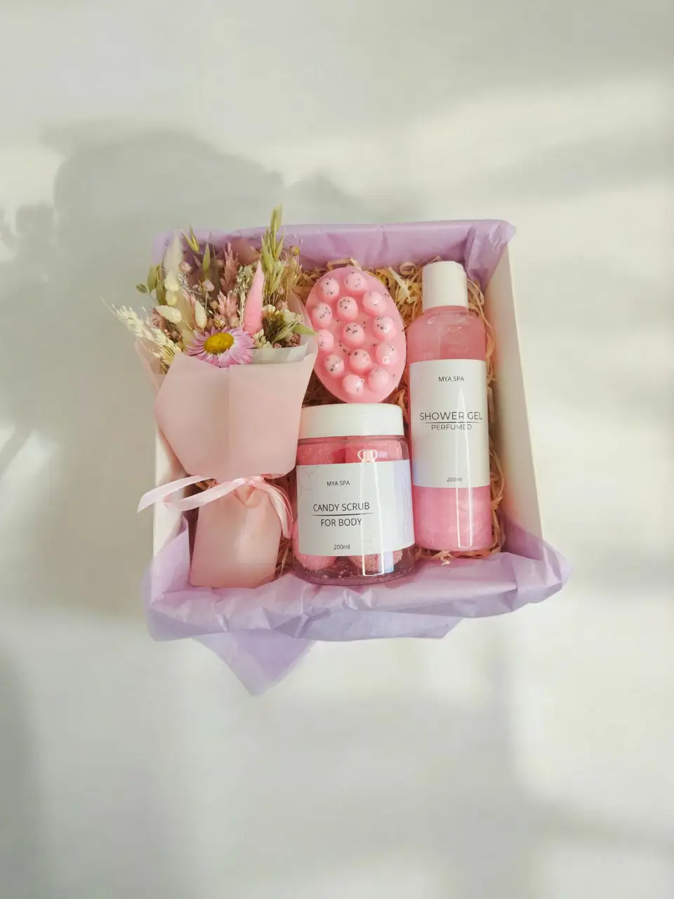 Pink spa box with candle, herbal tea and lip balm
