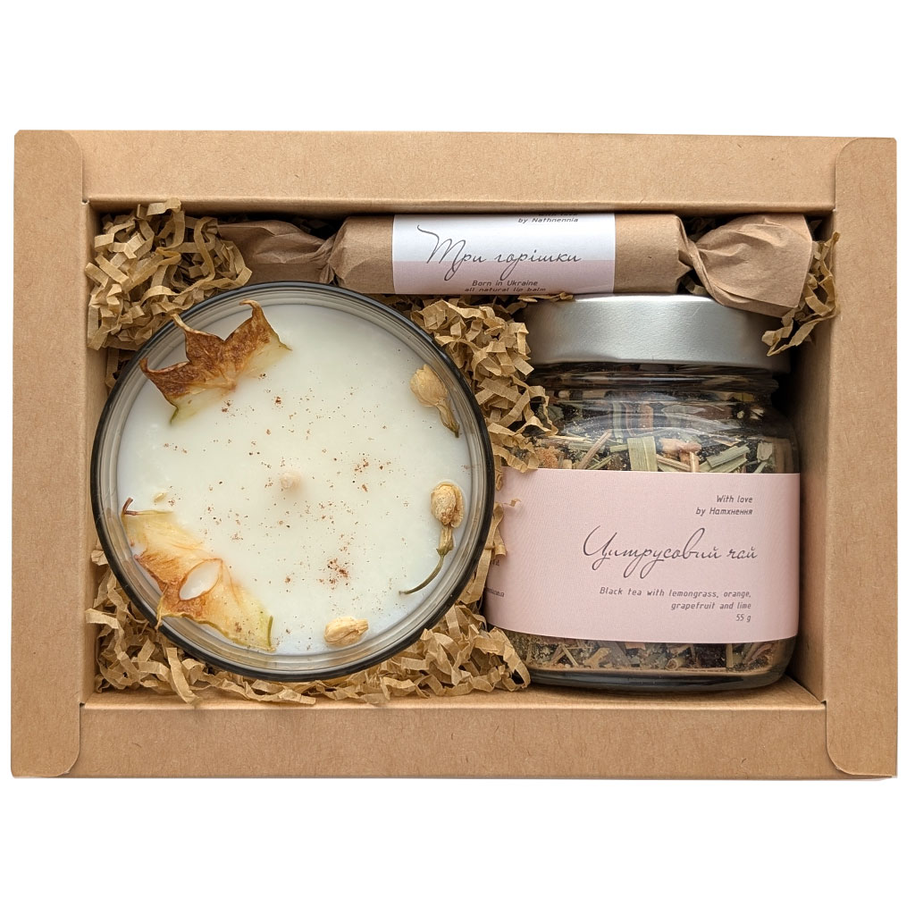 Kraft box with a soy candle, citrus herbal tea and a natural lip balm